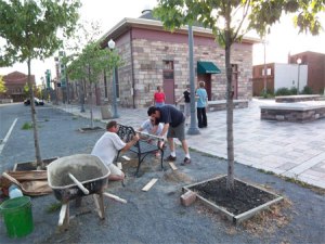 installing the memorial bench at the Broad Street Market